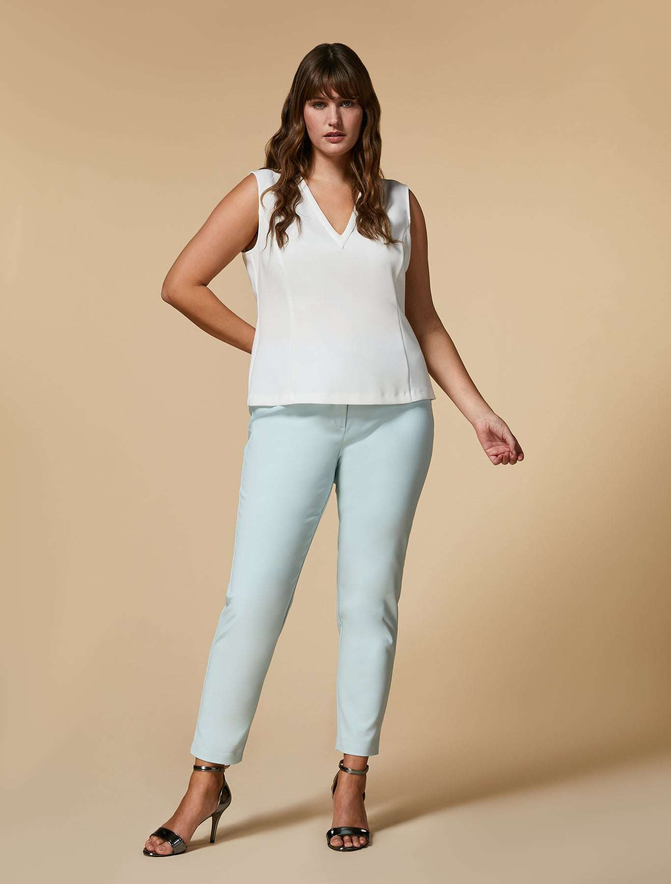 Thin trousers made of elastic cotton and nylon with elastic waist and hidden button and zipper