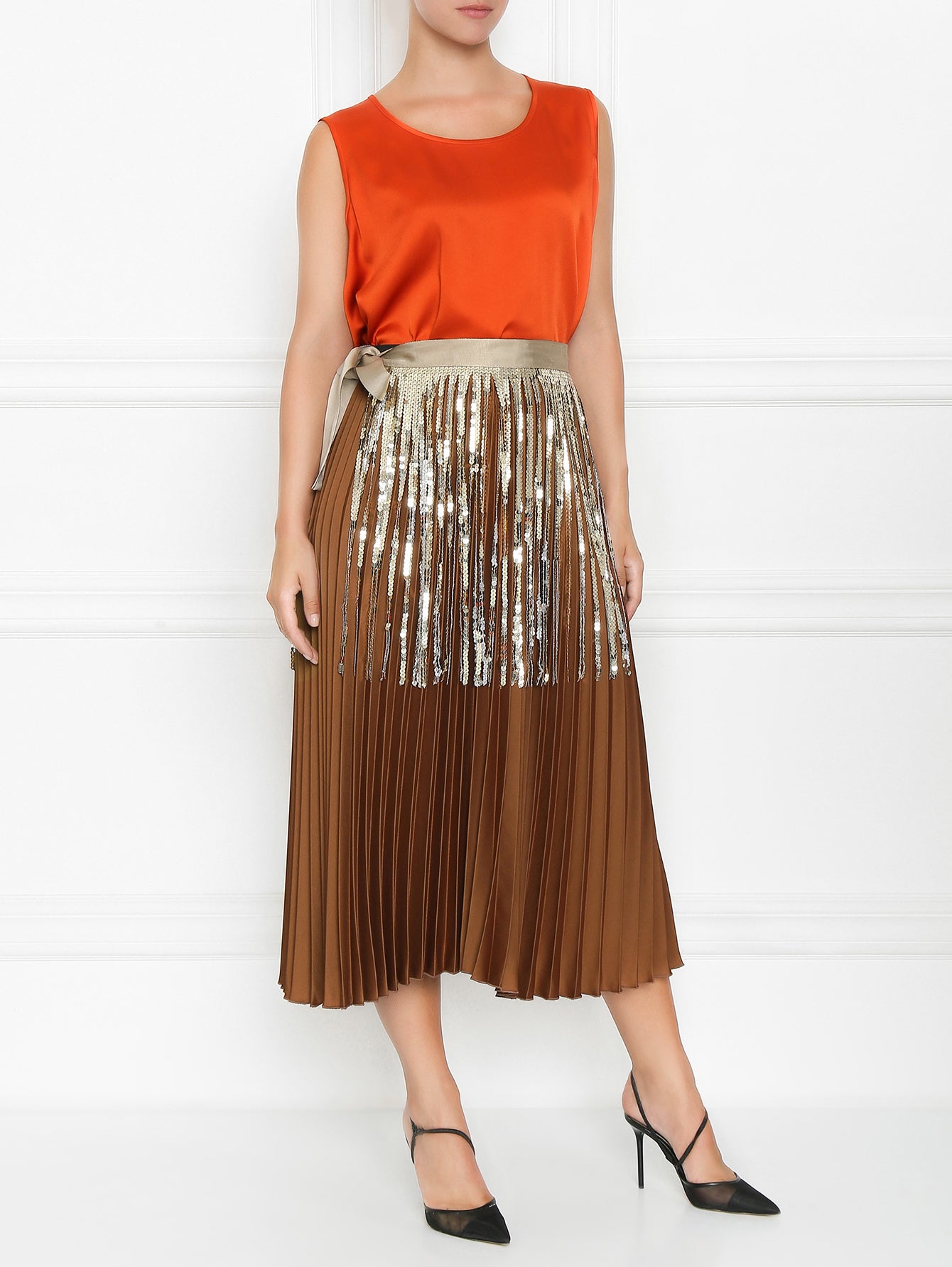 "Model Wearing a Larissa Belt with Sequin Fringe Over a Pleated Skirt"