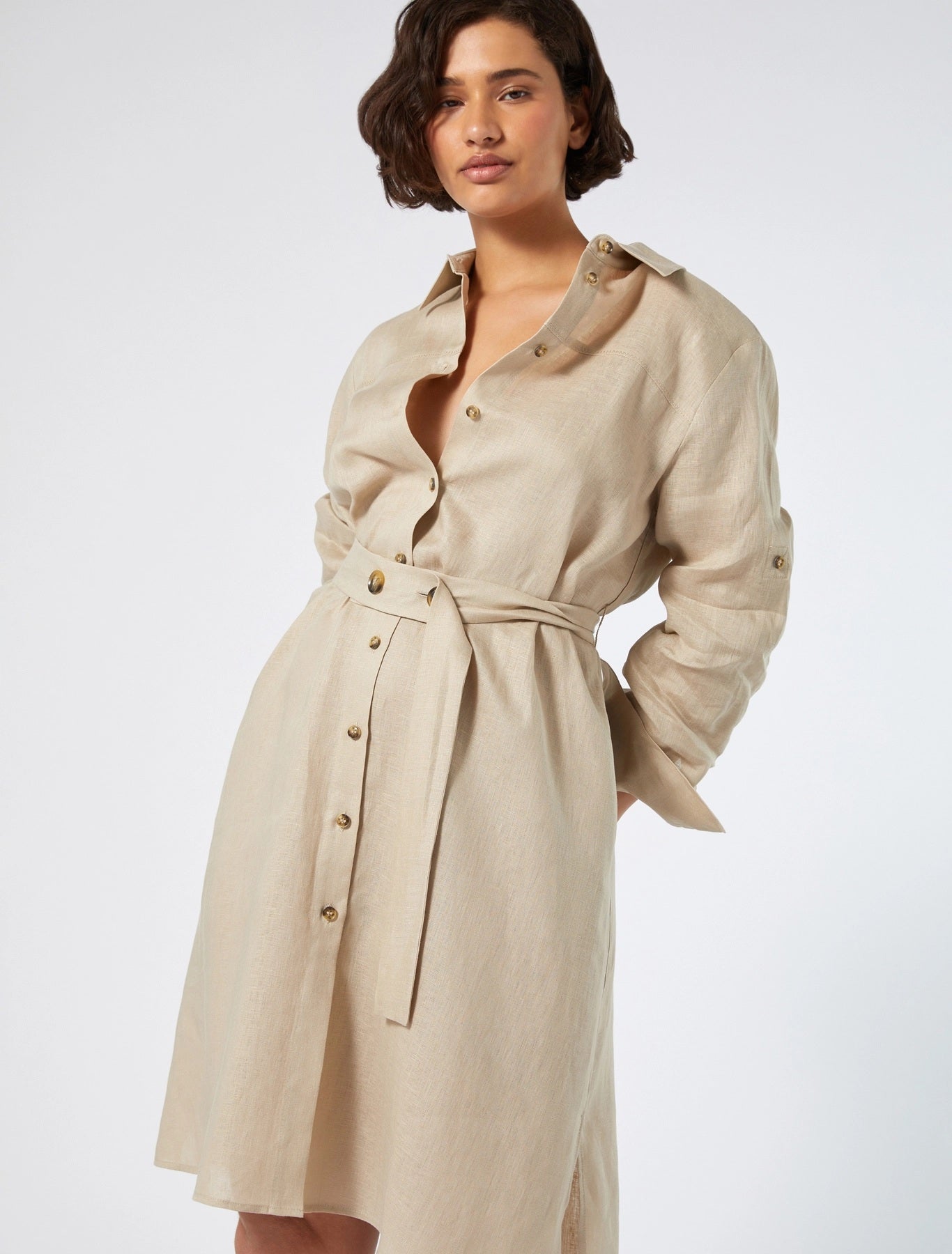 Close-up of topstitching on beige shirt dress by Persona by Marina Rinaldi