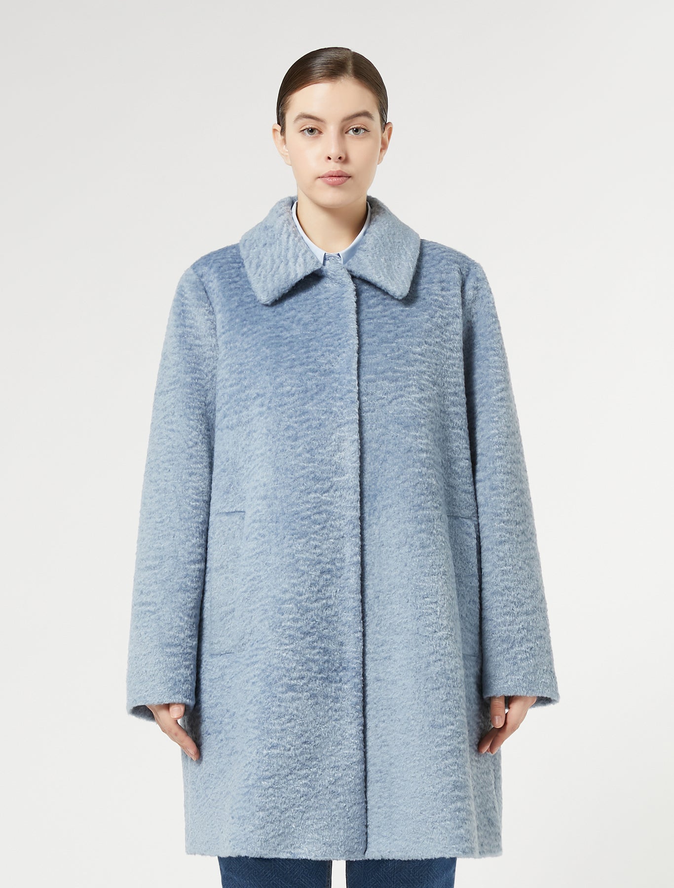 Introducing the must-have for your daily wardrobe, the jersey coat. Designed with a straight fit and press-stud fastening for a sleek look. The shirt collar, long sleeves, and lined interior provide warmth and style. Made with light textured jersey fabric, this coat is both comfortable and striking. Jersey fabric 100% polyester; lining 100% polyester.