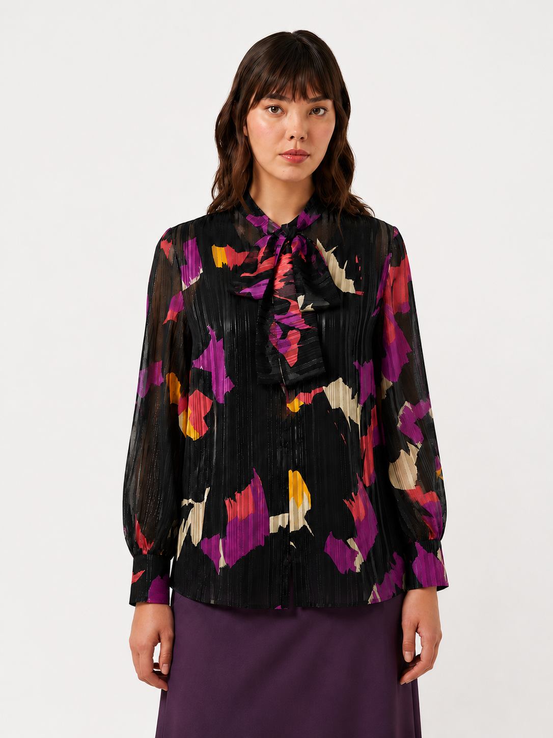 Elegant georgette blouse with metallic thread, gathered sleeves, high buttoned cuffs, and versatile V-neck bow for festive and business occasions.