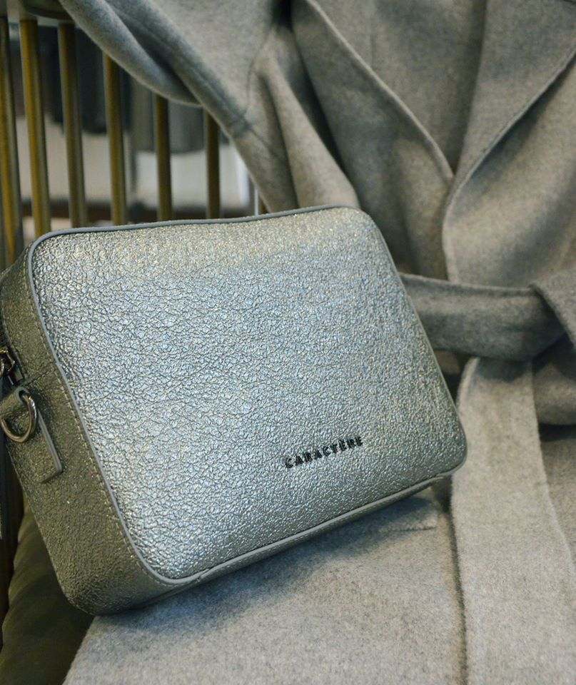 Silver Nappa leather crossbody bag by Caract?re with adjustable strap and minimalist design