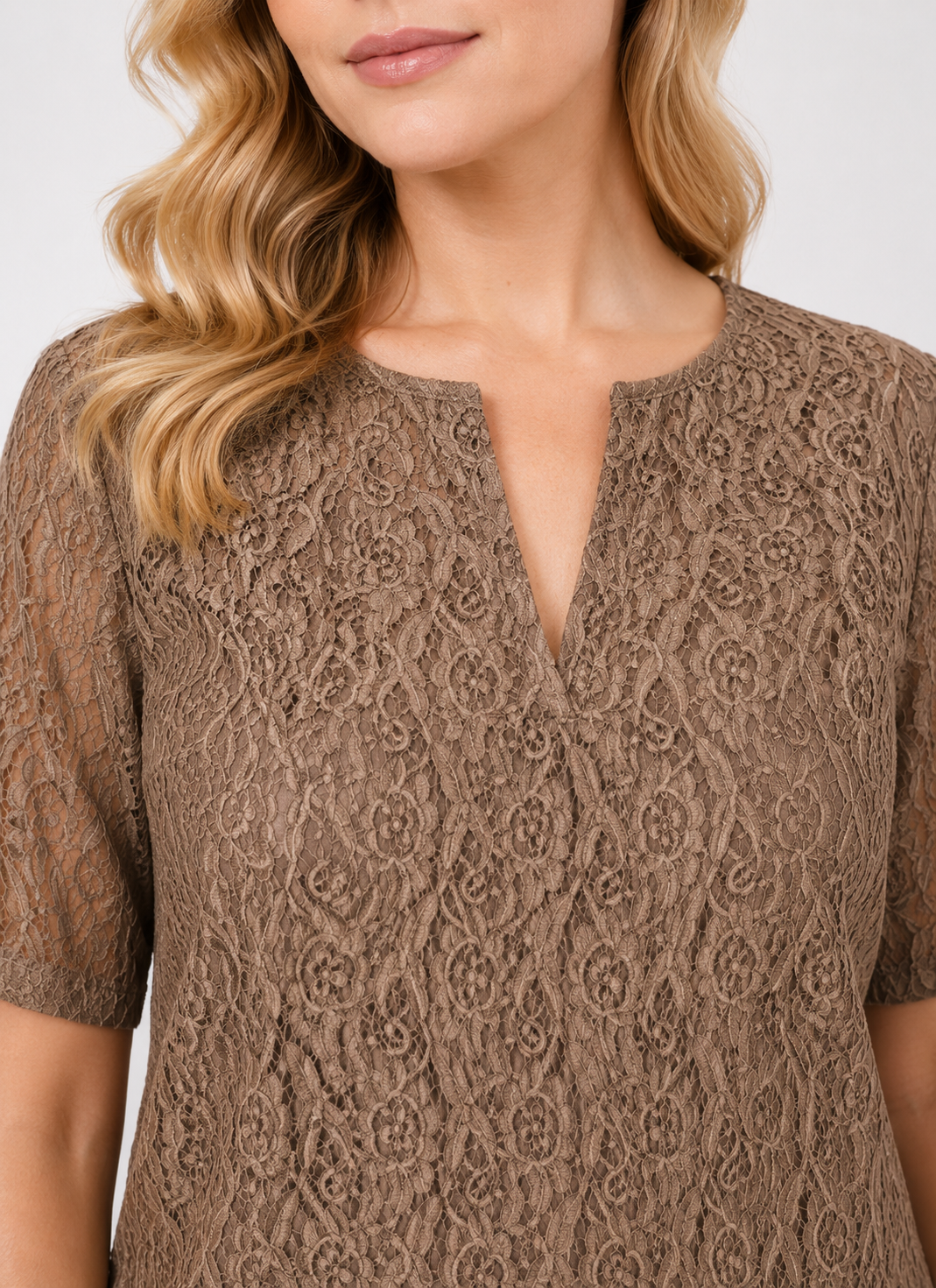 Woman wearing a DUO dress by Persona by Marina Rinaldi with short sleeves and V-neckline in stretch cotton lace
