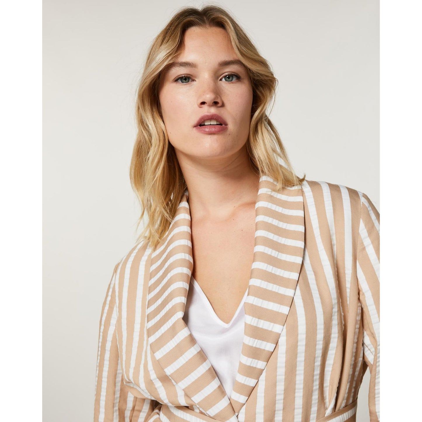 Close-up of STRENA striped jacket collar and neckline