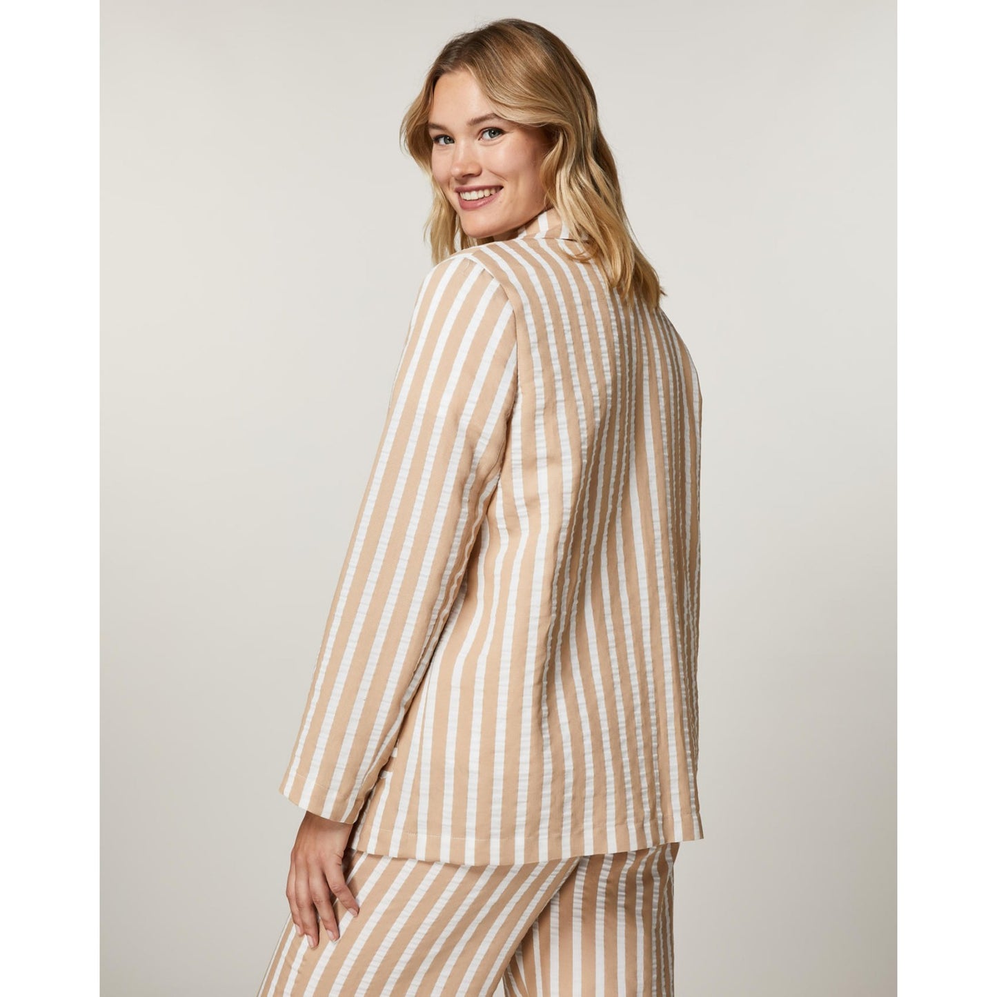 Back view of STRENA beige and white striped jacket
