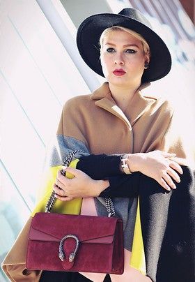 Beige ONTARIO cape with pink, grey, black, and lime intarsia design and sleeve slits by Marina Rinaldi