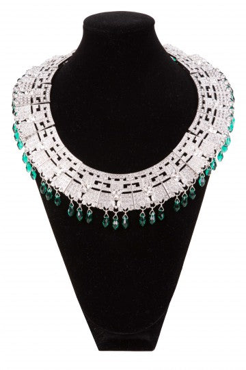 LAMA statement necklace displayed on black stand