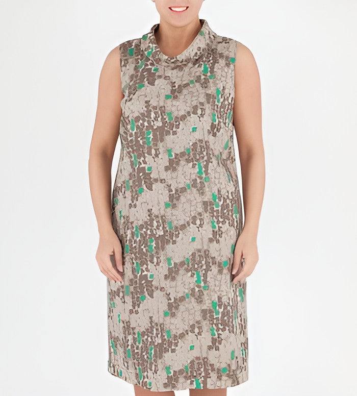 A sleeveless mock-neck dress with an abstract camouflage-like pattern in beige, brown, and green, shown on a model against a plain white background.