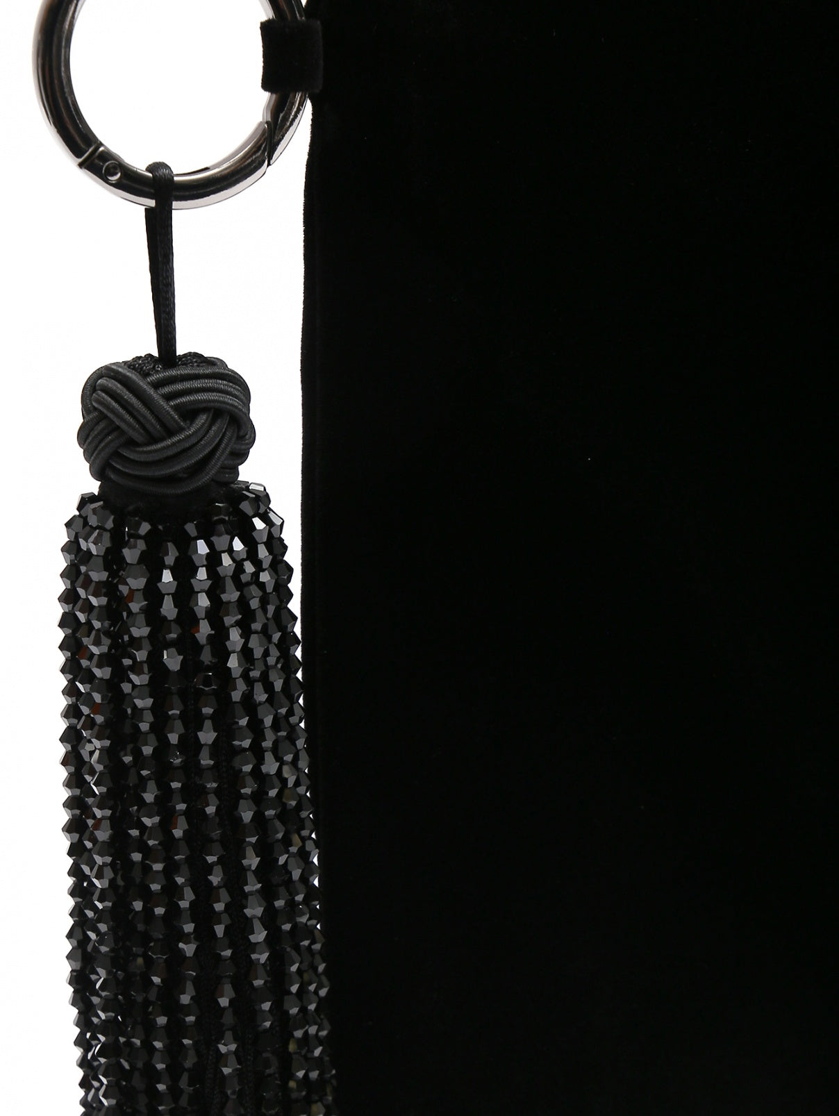 Close-up of black beaded tassel on SAHARA velvet clutch