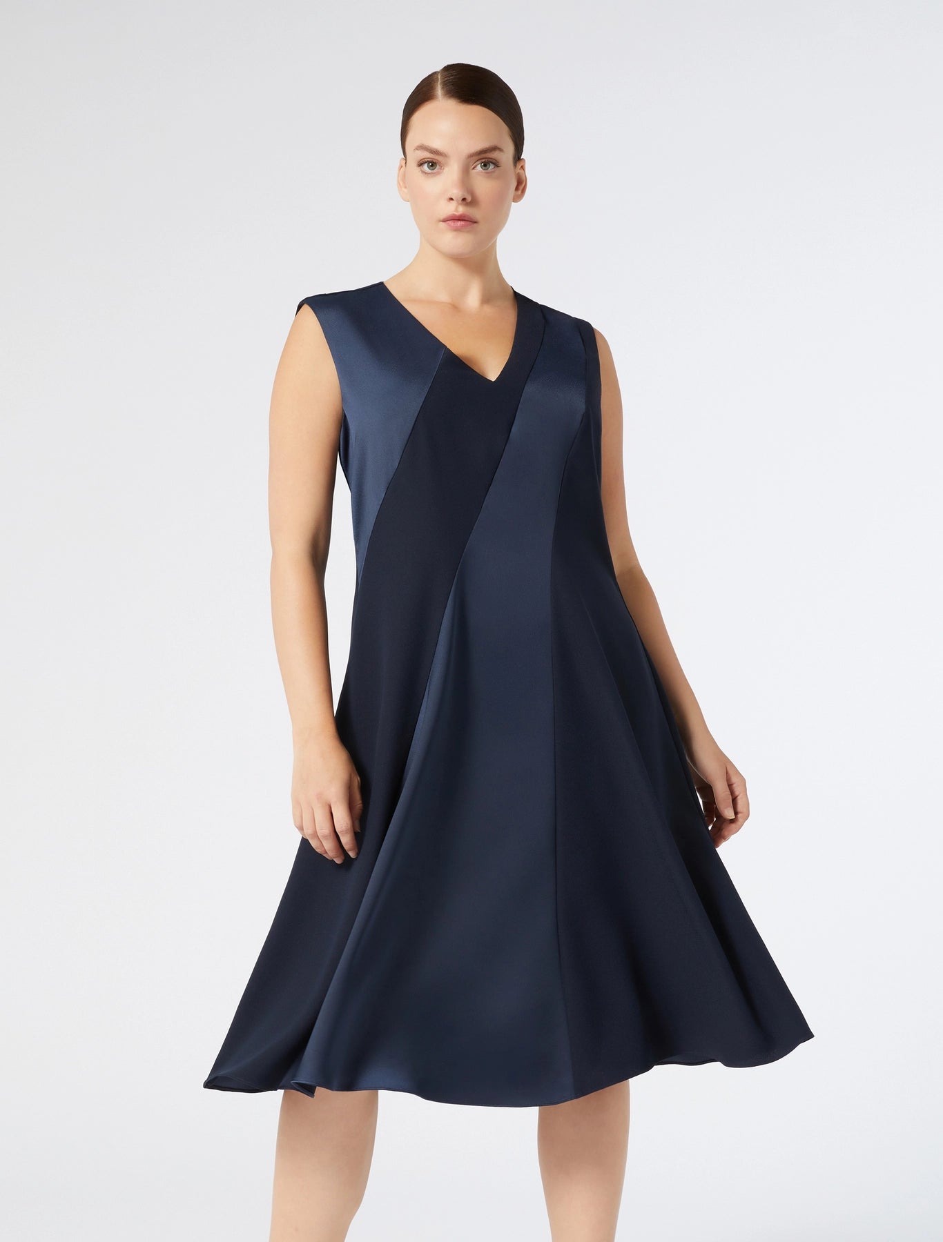 Model in full look wearing CLORURO sleeveless navy dress by Persona
