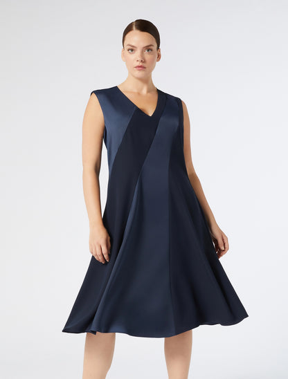 Model in full look wearing CLORURO sleeveless navy dress by Persona