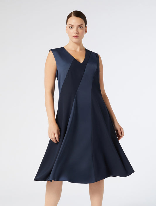 Model in full look wearing CLORURO sleeveless navy dress by Persona