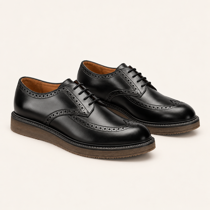 Black leather Marina Rinaldi LAURO Leather Oxford shoes with lace-up fronts, brogue detailing and chunky brown soles.