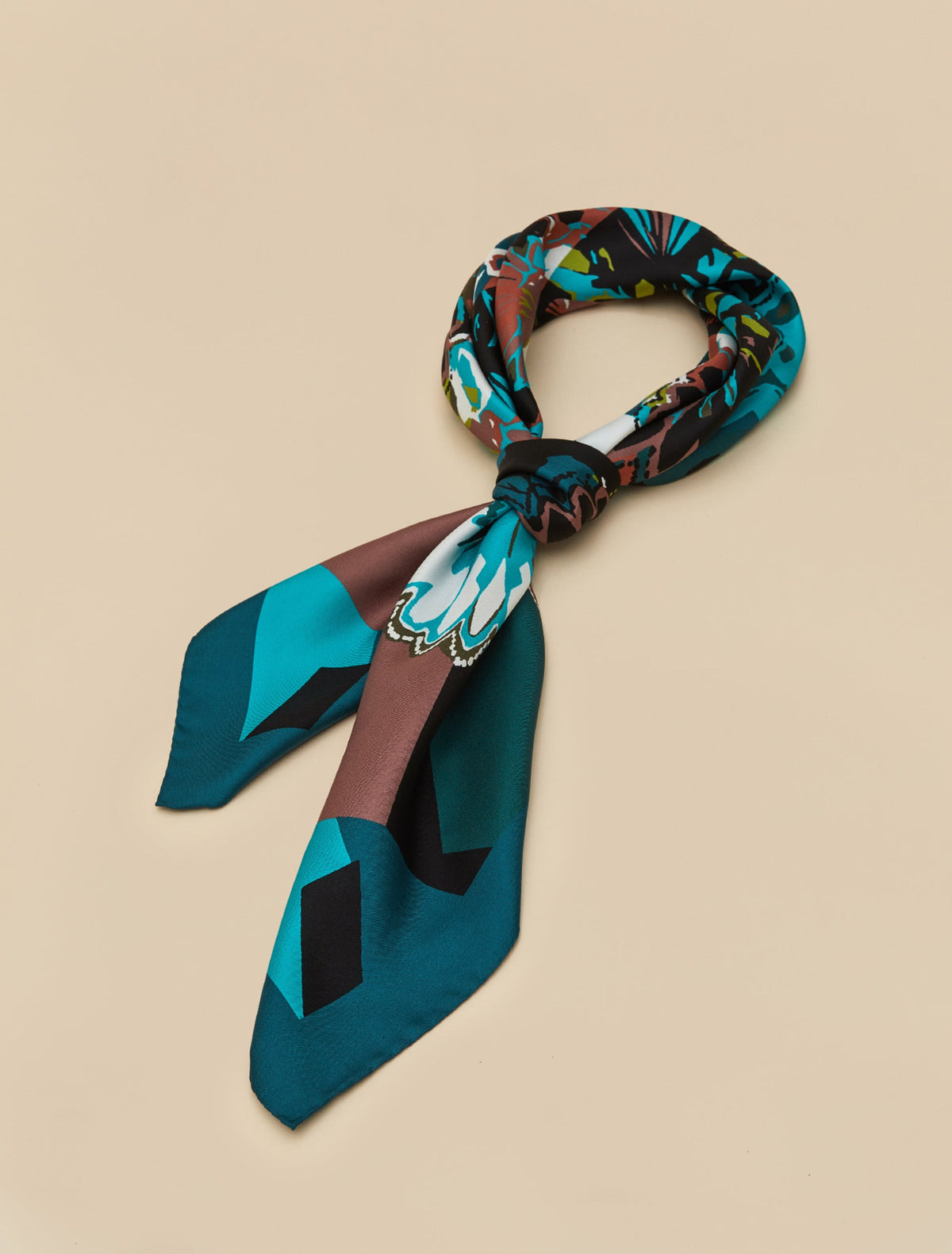 Printed silk twill neckerchief in teal, brown, black, and white with floral and geometric patterns, lightweight and smooth.