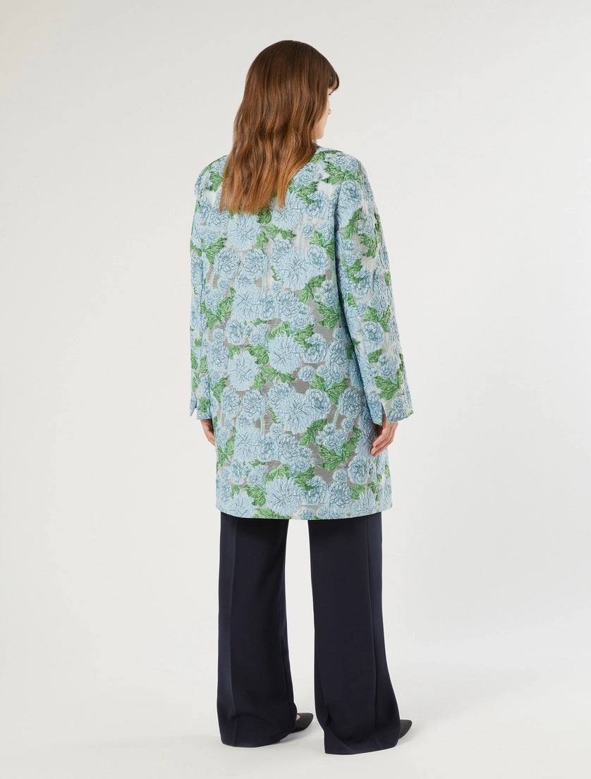 woman wearing blue and green floral jacquard duster coat from Persona by Marina Rinaldi back view