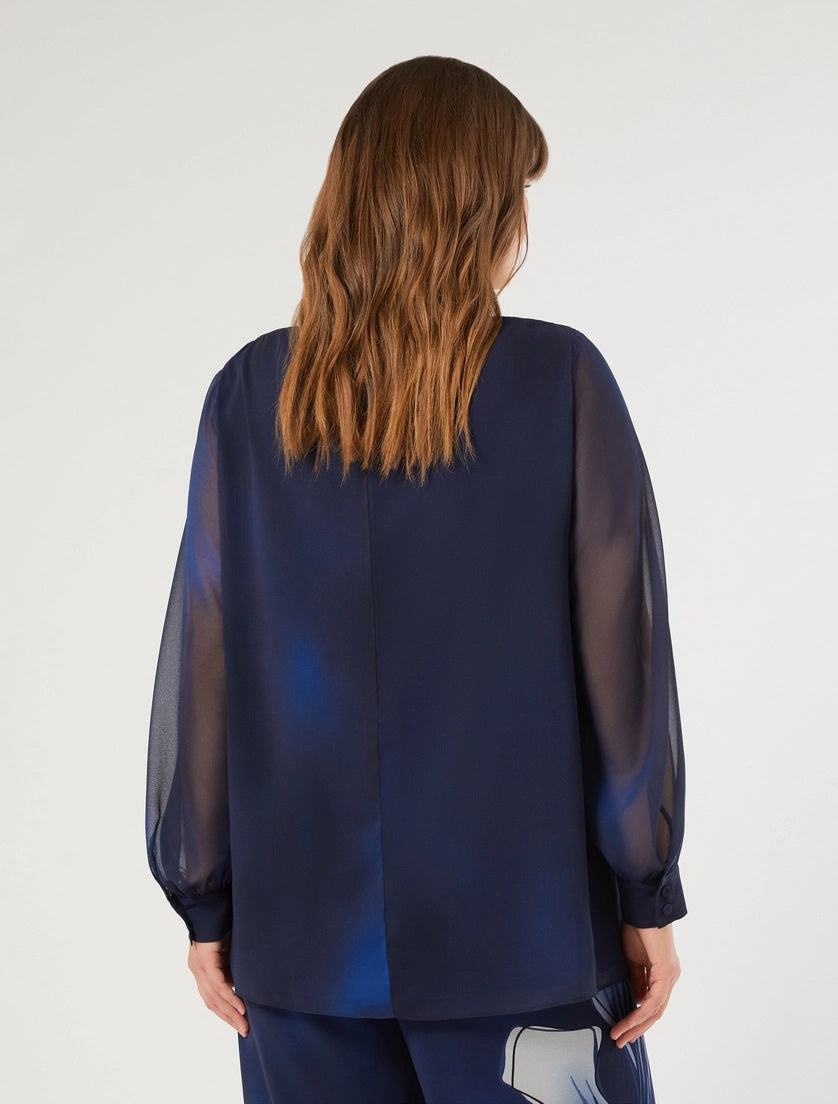 Back view of straight-cut georgette blouse with long sheer sleeves and gathered cuffs in navy blue
