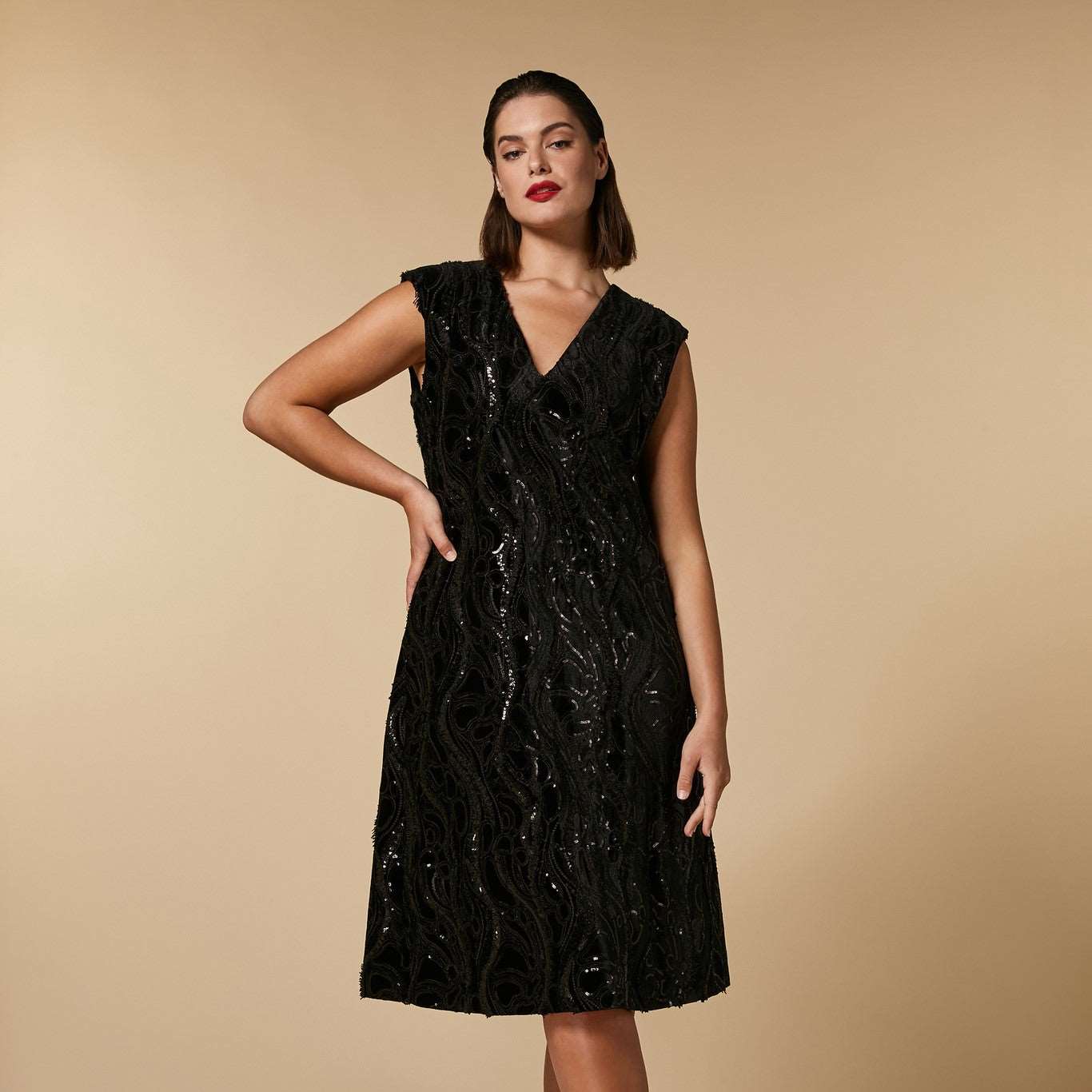 MariDress made of embroidered stretch velvet fabric, with structured shoulders and a V-shaped neckline; both creating a unique graphic effect.na Rinaldi Dress