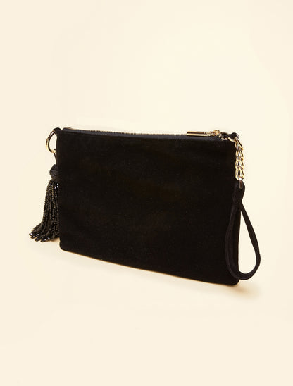 SAHARA clutch from side view showing wrist strap and tassel