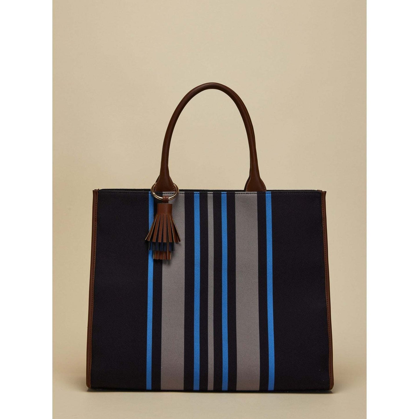 SANDY striped canvas tote bag with red, navy, and white stripes, double handles, and tassel pendant