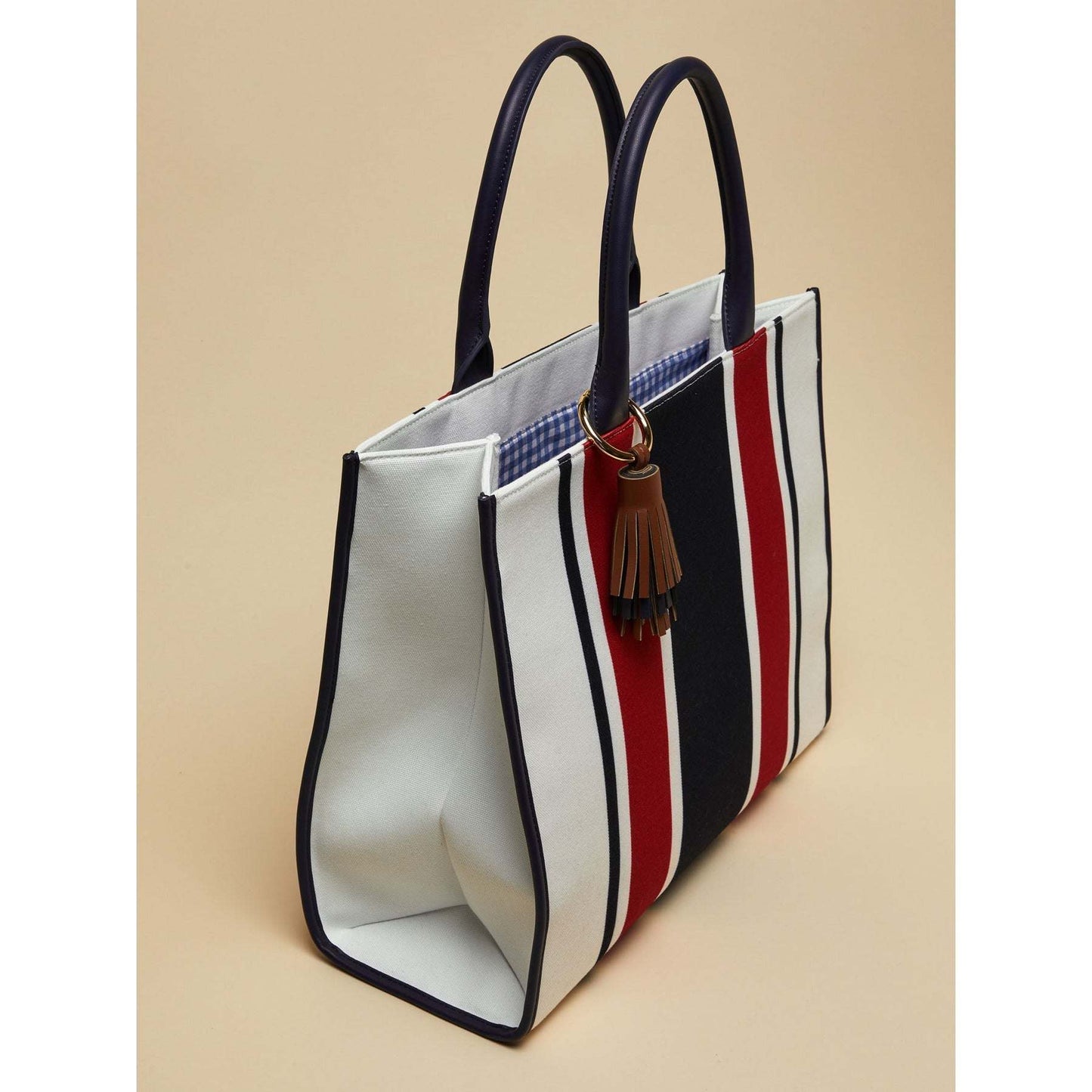 SANDY striped canvas tote bag in red, navy, and white with double handles and tassel pendant