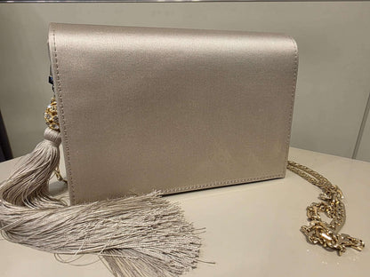 Pearl satin leather bag with rhinestone tassel and gold-tone chain strap by Marina Rinaldi