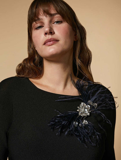 Bejeweled brooch with chatons, ostrich feather, and stone details on metal base