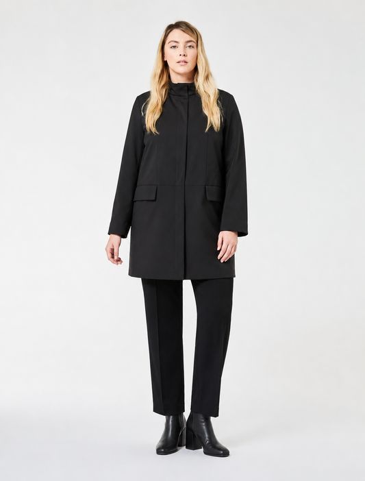 Woman wearing NESSO quilted coat with stand-up collar and flap pockets in urban setting
