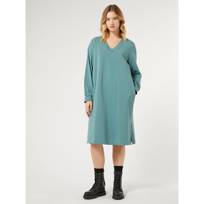 Introducing our newest addition to the Persona by Marina Rinaldi collection - the Jersey Dress AGIO. This sportswear-inspired cotton jersey fleece dress features a V neck and ribbed long sleeves for a comfortable and stylish look. The stretch cotton sweatshirt fabric and side slits at the hem make it easy to wear and match. Perfect for any occasion, its straight cut and ribbed details make it a must-have in your wardrobe.  Made of 96% cotton and 4% elastane for the perfect fit.