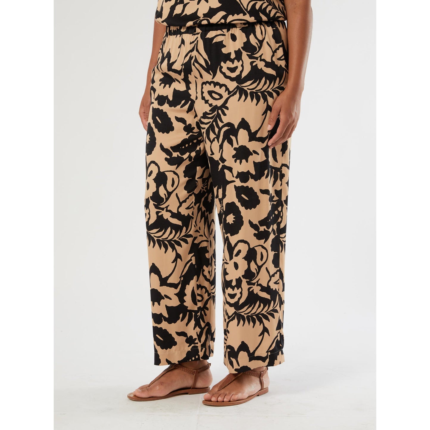 BIKINI printed viscose satin trousers with bold print and fluid cropped silhouette