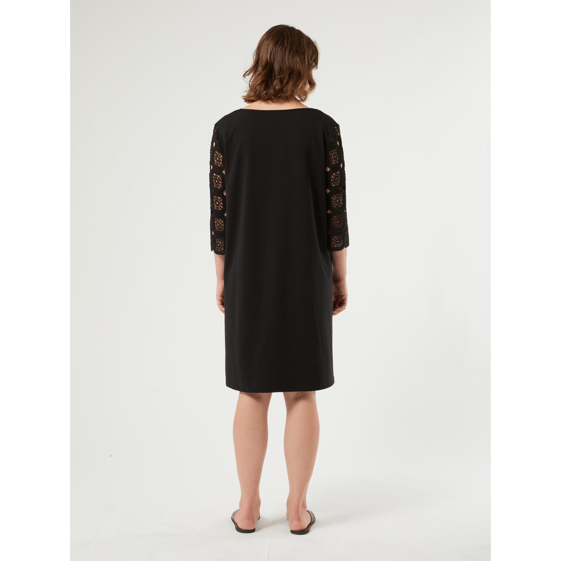 AFELIO crochet dress in breathable cotton with V-neckline and tassel ties, featuring a straight fit and soft jersey back for comfortable elegance