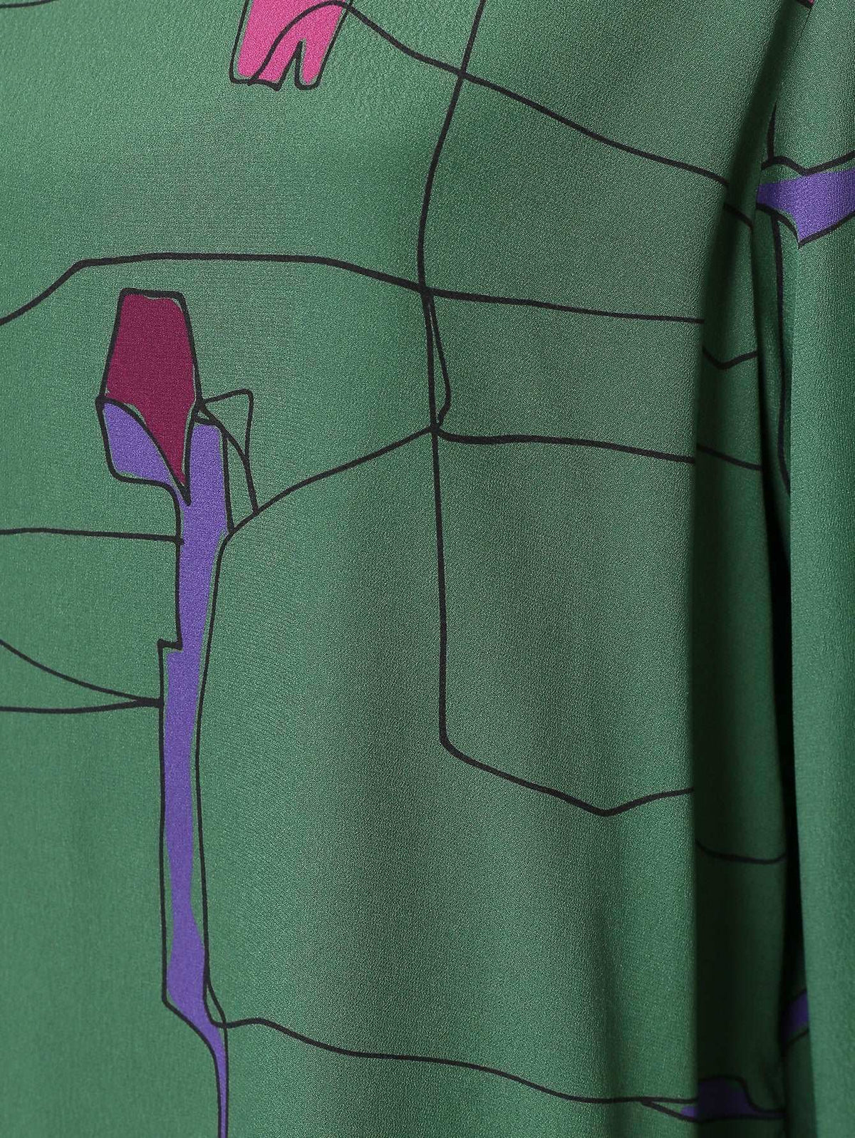 Dress DARSEN featuring green flowing fabric with abstract black lines and purple and pink floral accents, smooth texture.