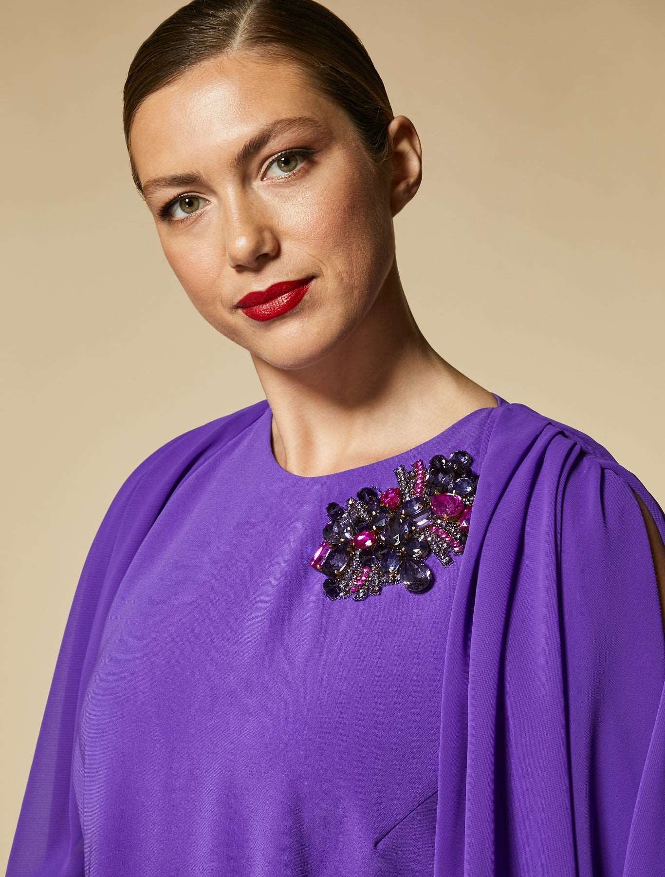 Elegant Dress DEDICATO in crepe georgette with pleats, draping, and colorful crystal embroidery