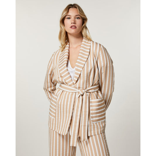 Front view of STRENA jacket styled with matching trousers