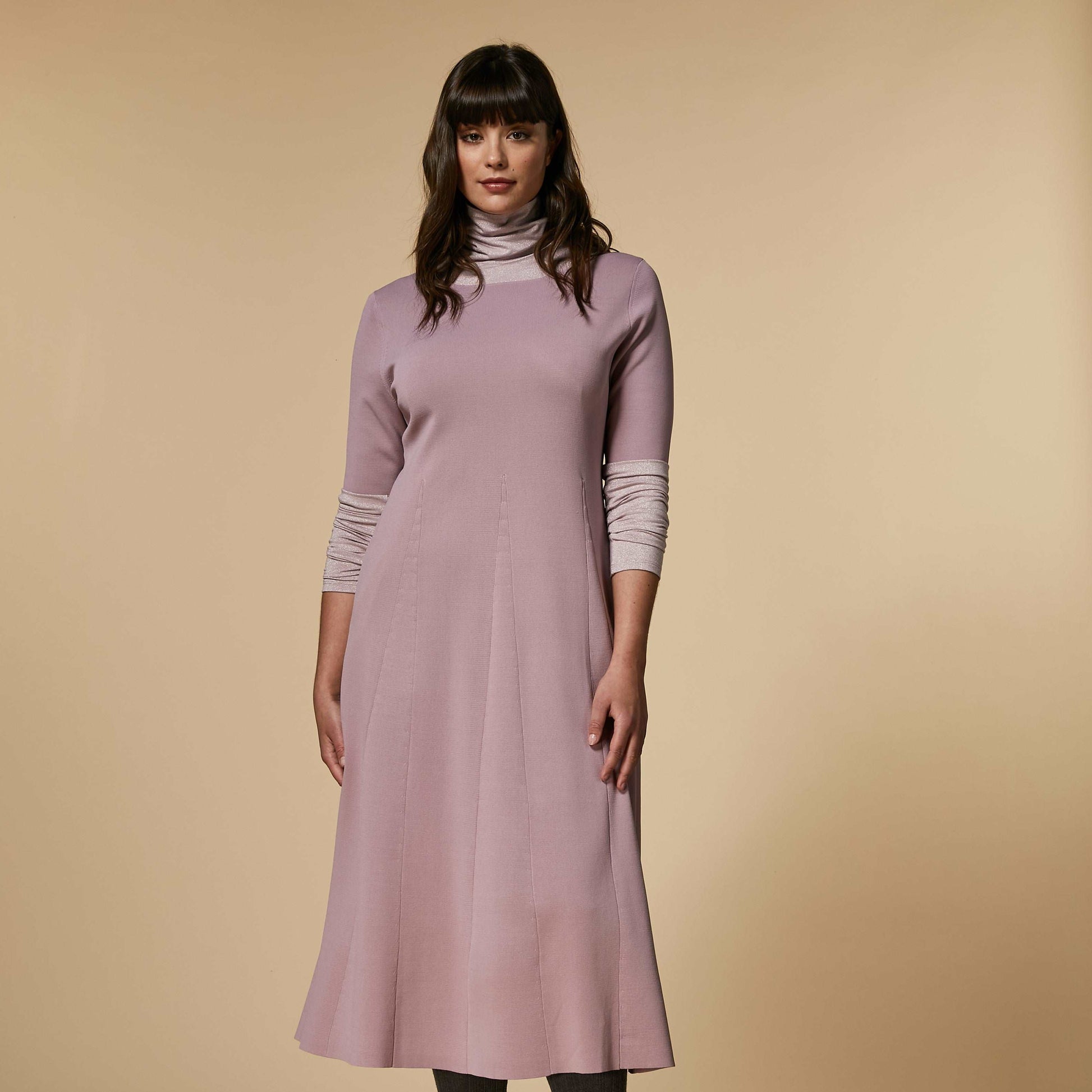 Dress made of stretchy viscose Milano stitch knit, with a segmented intarsia wedge construction to create a striking effect. Wide neckline, long sleeves, and a flared silhouette. Intricate detailing that creates a versatile feminine line.