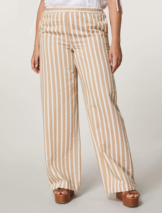 Woman wearing CRISMA striped palazzo trousers with elastic waistband and side pockets in lightweight viscose jacquard fabric