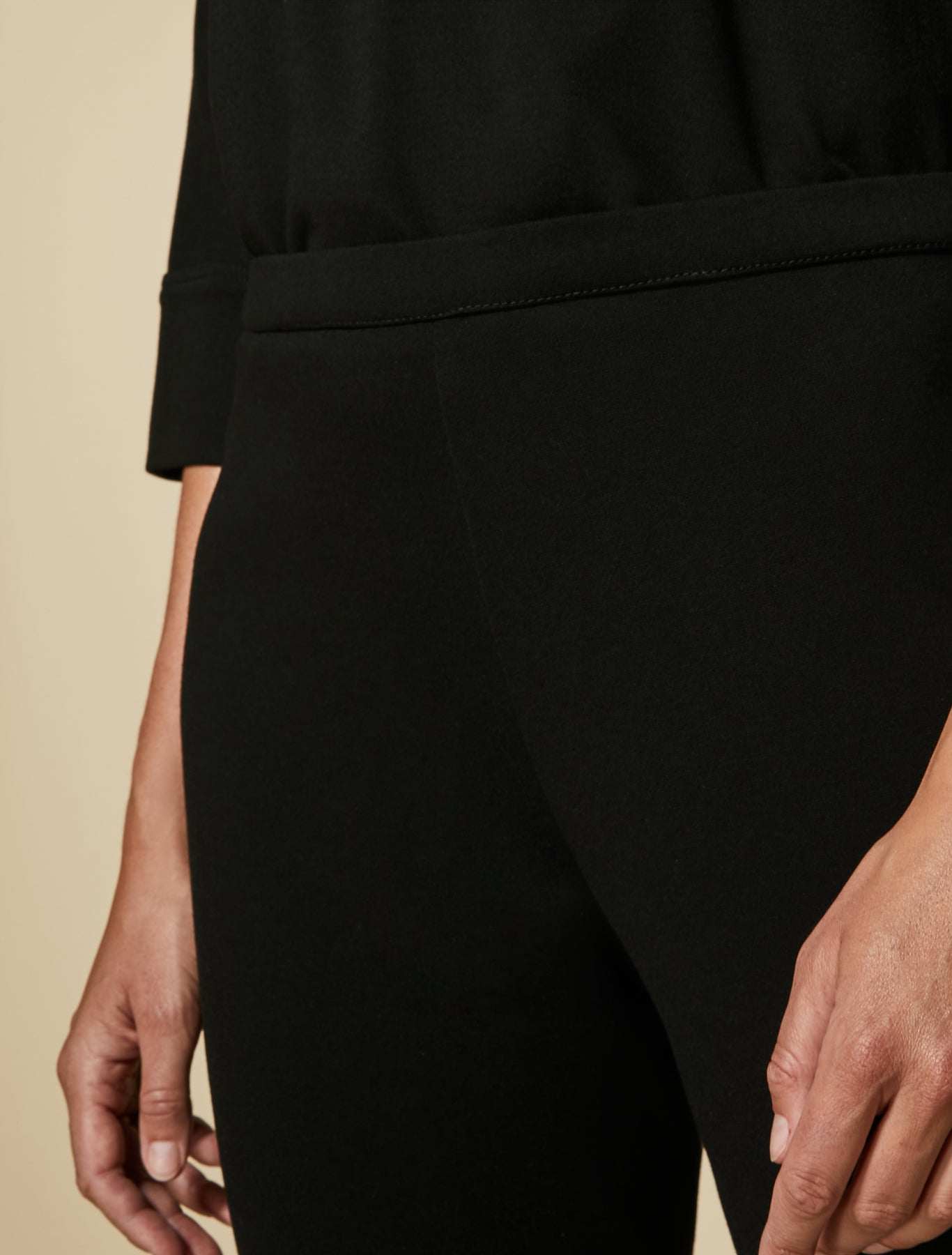 Trousers OCCHIATA-1 with elastic waist and split arrow design in black jersey fabric