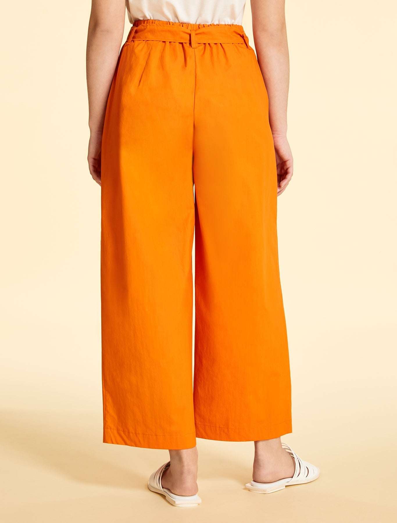 Wide-cut cotton poplin trousers in orange with elastic waistband and removable belt