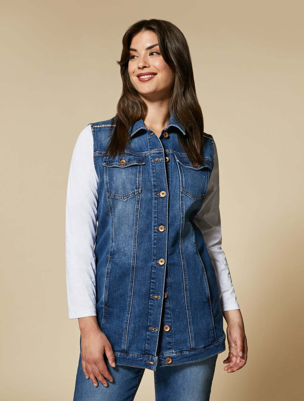 GABBIATE denim vest in blue stretch cotton with metal button placket, flap chest pockets, and fitted silhouette.