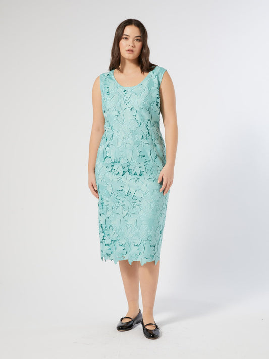Model wearing a mint-colored JUSTIN lace midi dress with sleeves and below-knee length from the brand Persona by Marina Rinaldi