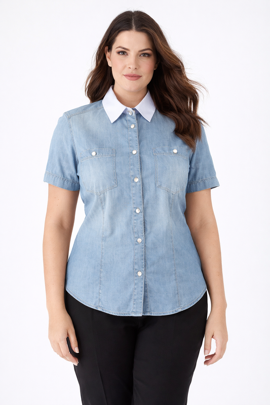 Woman wearing GASTRO Denim Shirt with pearl buttons and contrast collar, short sleeves, fitted silhouette.
