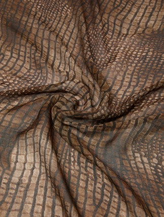 A close-up of draped fabric with a brown and beige wavy stripe pattern, showing the material's texture and color.